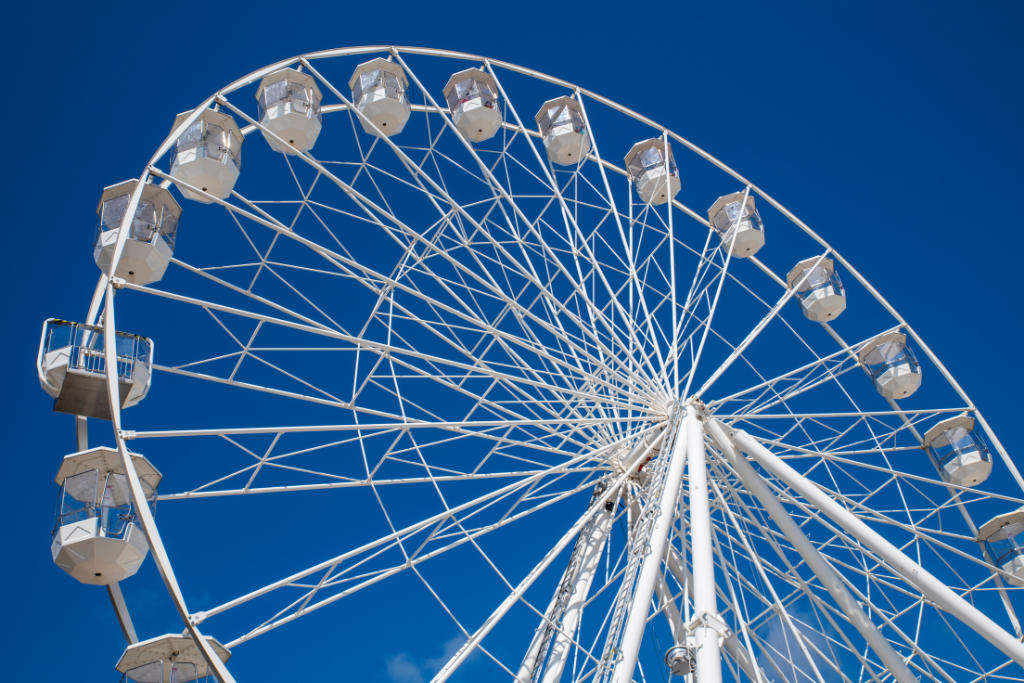 White ferris wheel against blue sky