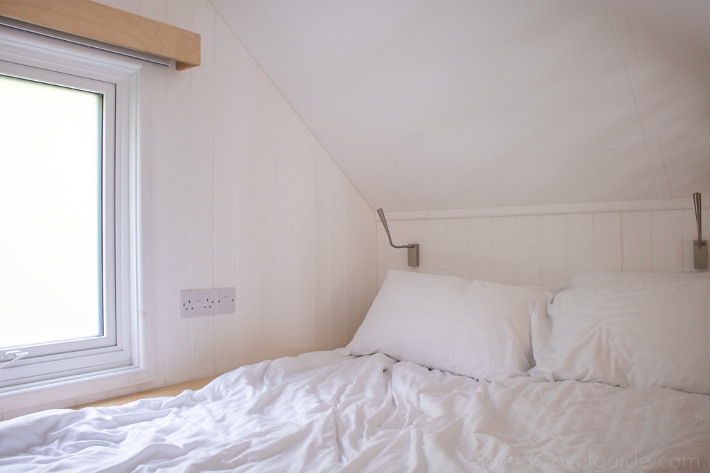 Bed with white duvet