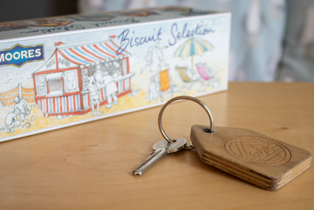 Key with wooden keyring on a table