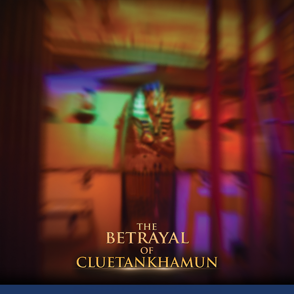 very blurry image of tutunkhamun's sarcophogus against a wall with a few boxes around it and the words "the betrayal of Cluetankhamun" written over the image in yellow text