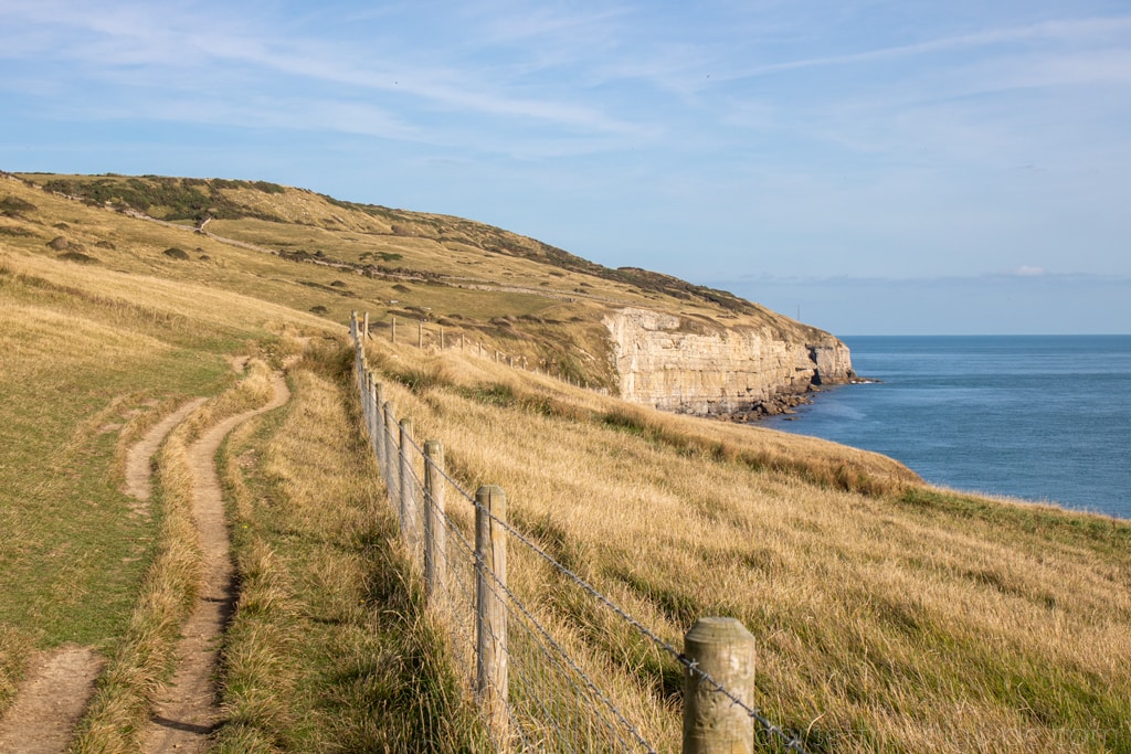 walk along a cliff edge towards Dancing Ledge in Dorset