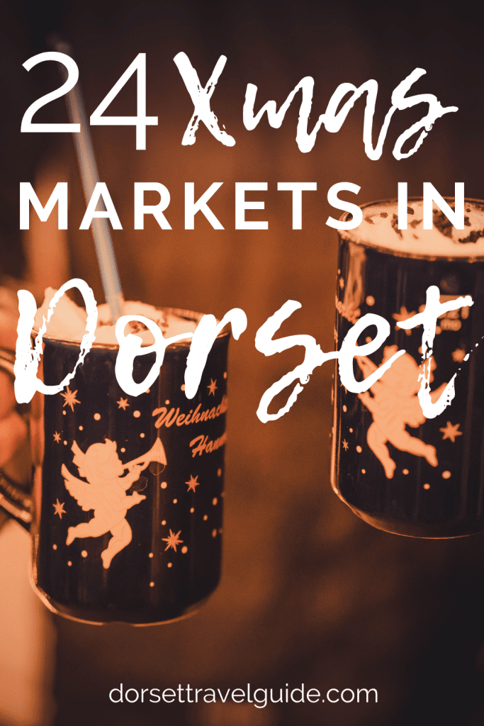 24 Christmas Markets in Dorset - poster with title in white and a photo of two mugs of hot chocolate topped with cream