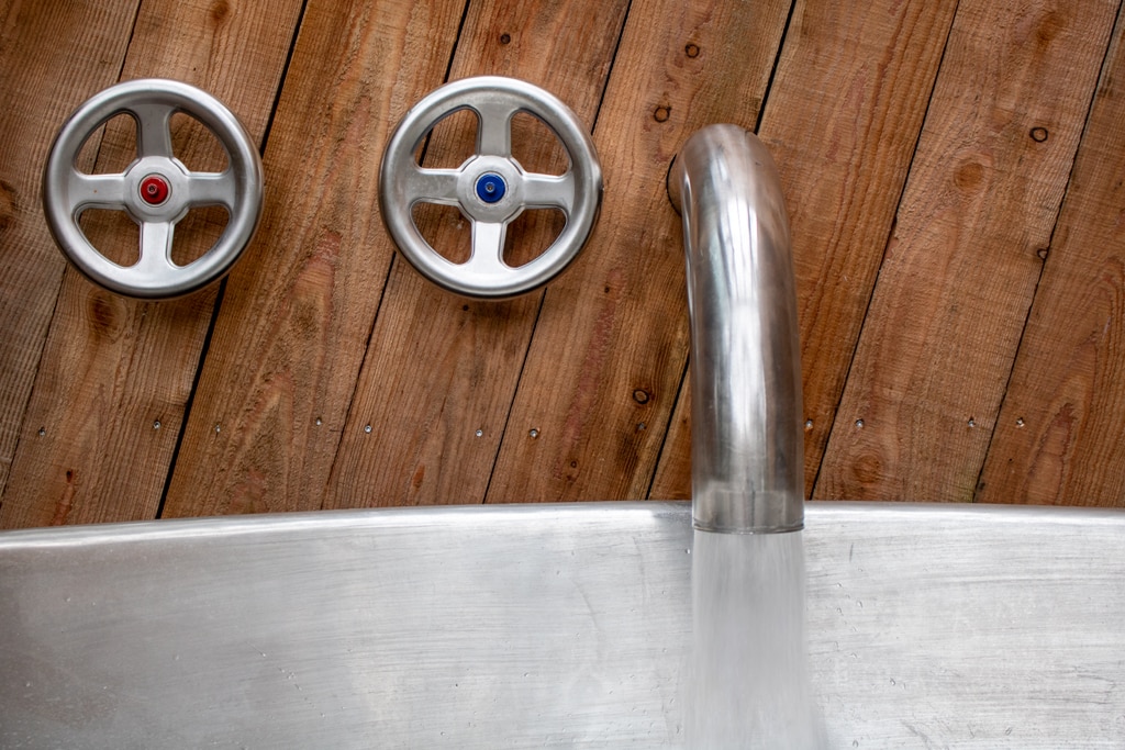 close up of a hot tub tap with circular taps