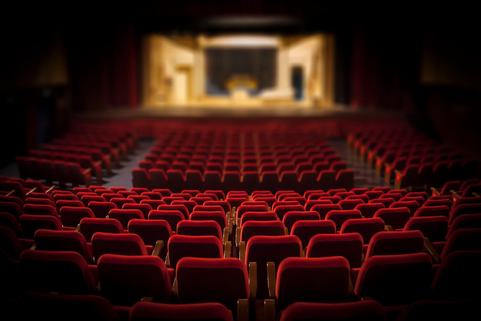 Empty red armchairs of a theater ready for a show | pantos and christmas shows dorset